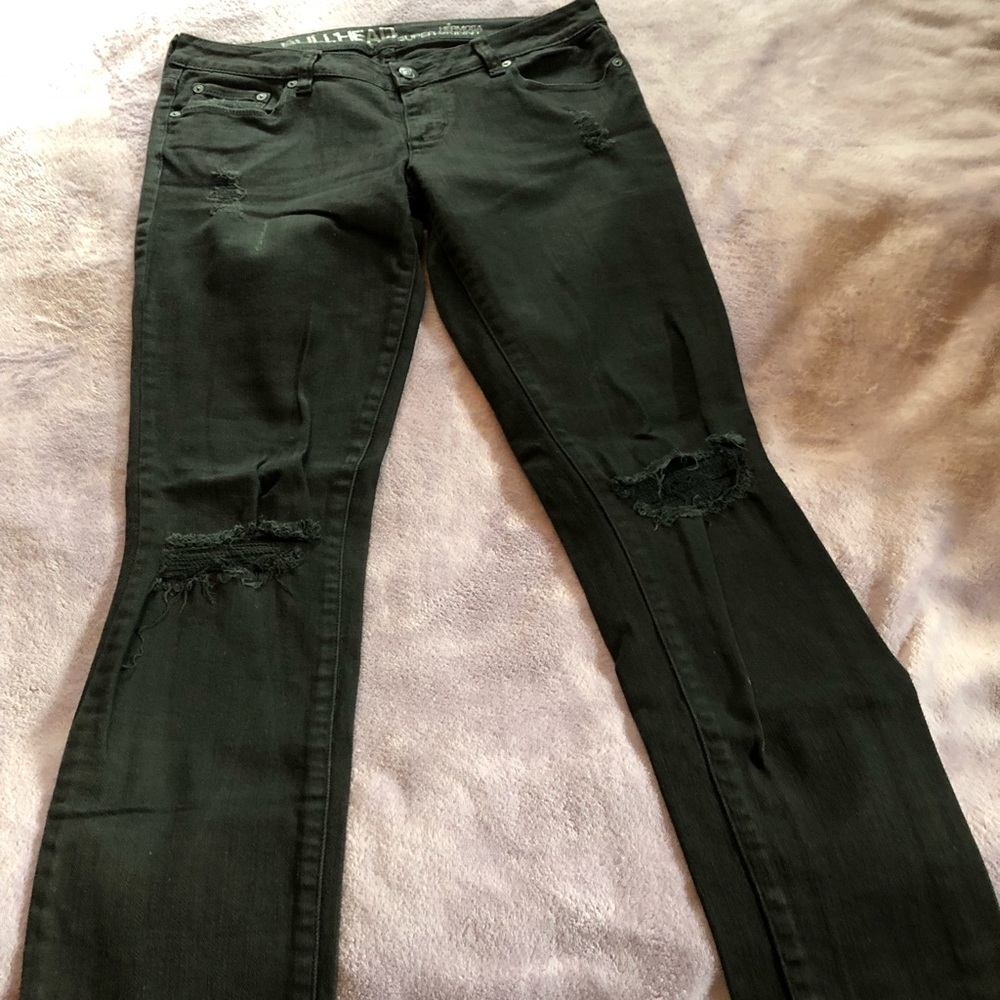 Black jeans. Torn knees.